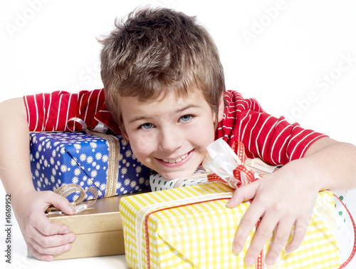 little boy with gifts on a light background