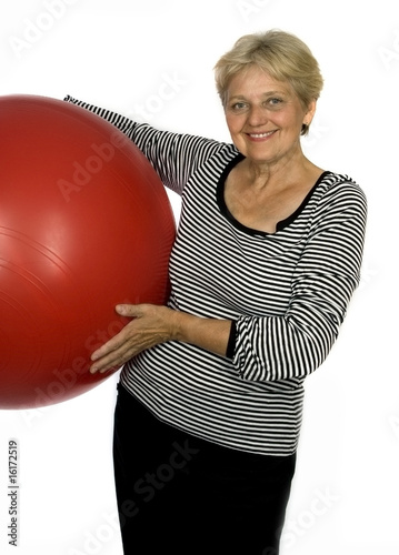 Photography happy older pensioner woman with ball