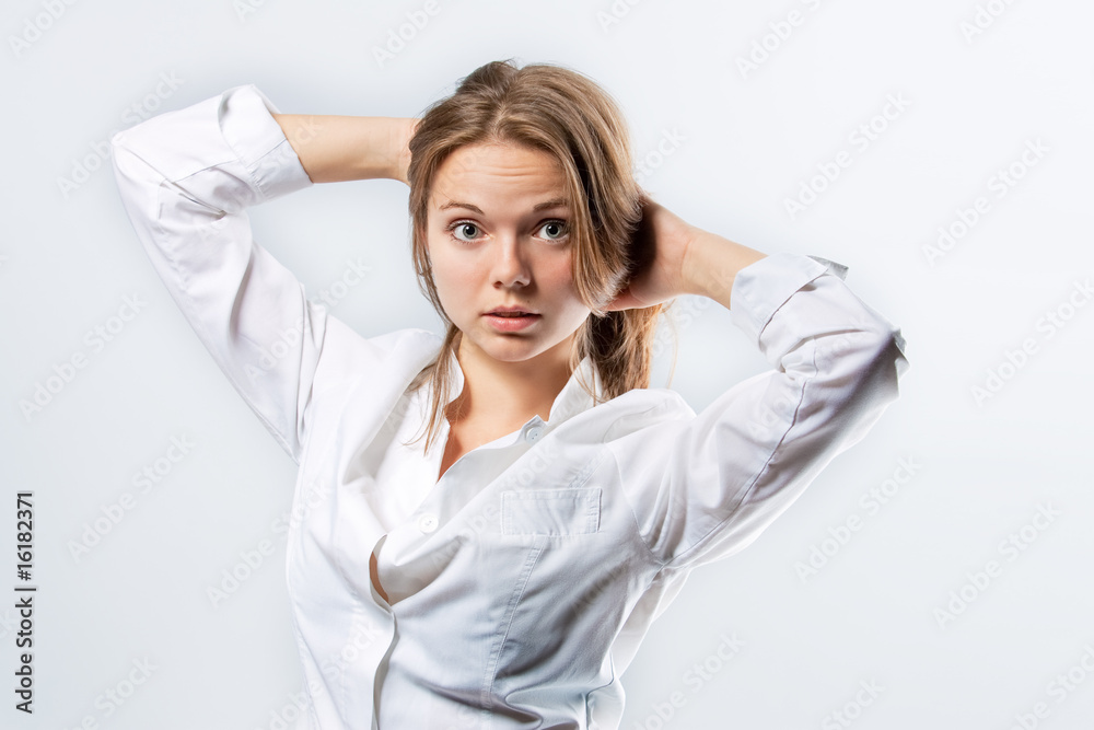 attractive young woman in whites standing with lifted arms attractive young woman in whites standing with lifted arms