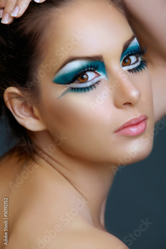 Fototapeta Naklejka Na Ścianę i Meble -  Woman with turquoise make-up.