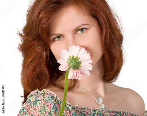 woman smelling a flower