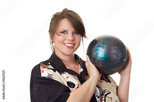 Young happy woman holding a bowling ball; isolated on white
