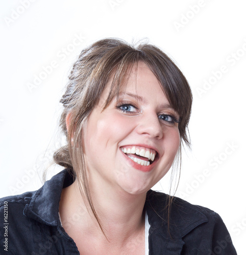Happy and laughing young woman; head and shoulders