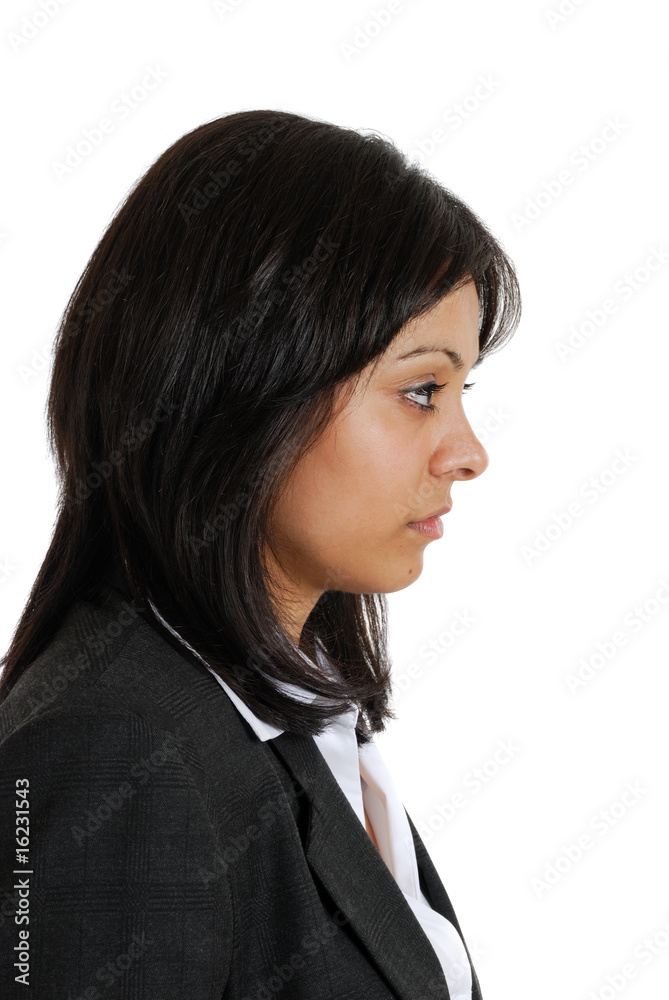 Business woman looking away in seriousness Business woman looking away in seriousness