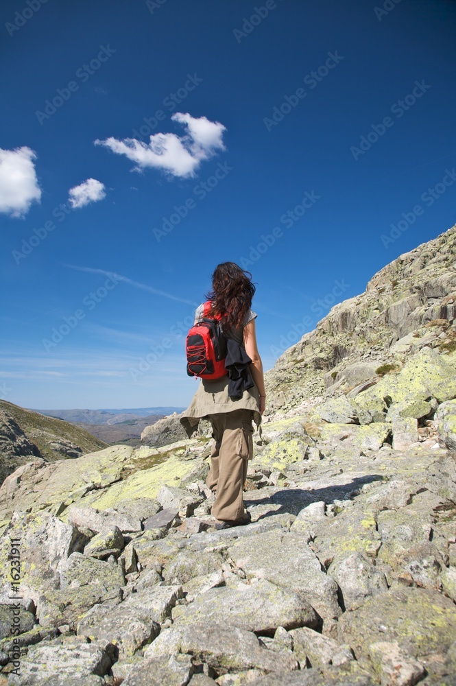 trekking woman and clouds