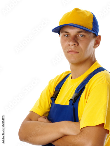 Young worker wearing baseball hat and uniform