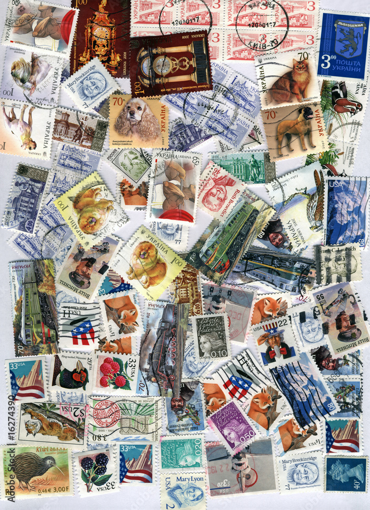 heap of different vintage post stamps, paper texture background closeup, hobby collection diversity
