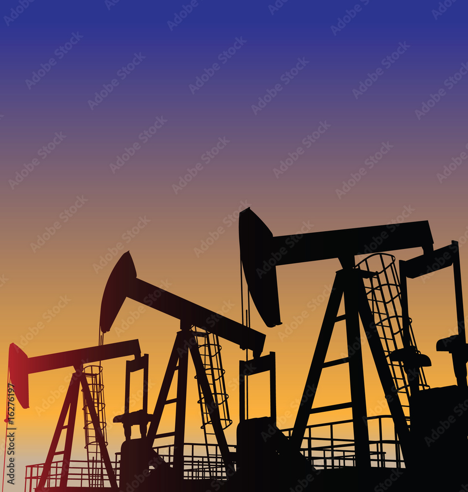 Three oil wells in the desert at dusk Three oil wells in the desert at dusk