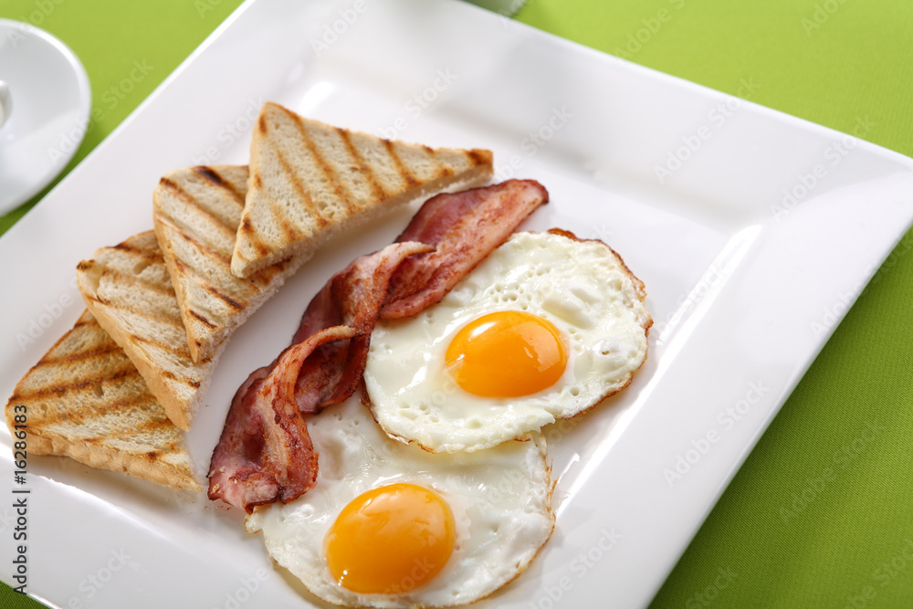 Breakfast - toasts, eggs, bacon Breakfast - toasts, eggs, bacon