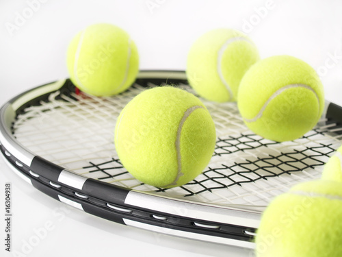 tennis racket and balls on white