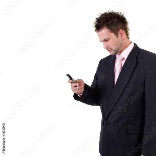 Frowned businessman with cell phone photo
