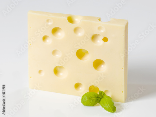 Slice of hard cheese photo