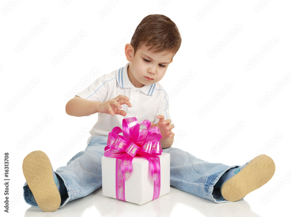 The little boy with a gift in a hands The little boy with a gift in a hands