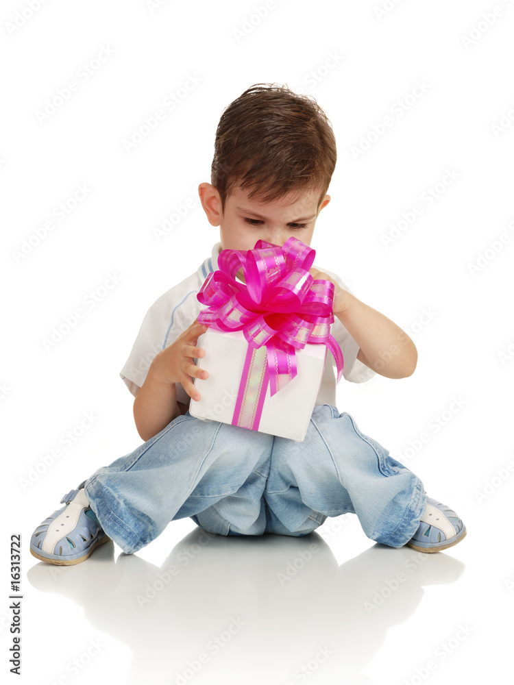 The little boy with a gift in a hands The little boy with a gift in a hands