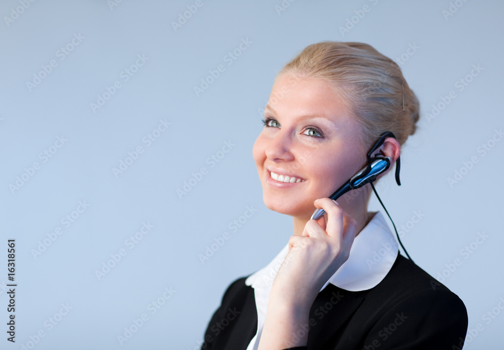 Attractive Business woman talking on a head piece Attractive Business woman talking on a head piece