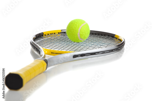A tennis ball and racket on white © Michael Flippo