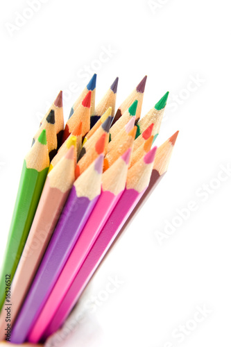 colored pencils in closeup over white background