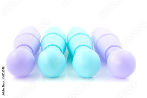 blue and purple colored bowling pins over white background