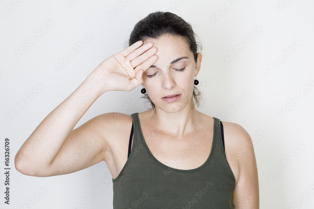 Young woman with headache isolated on white background Young woman with headache isolated on white background