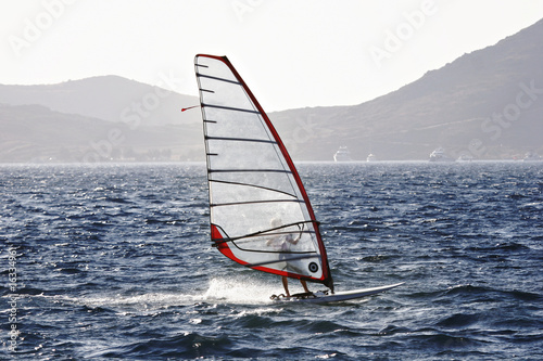 wind surfer enjoying freedom and speed © altug