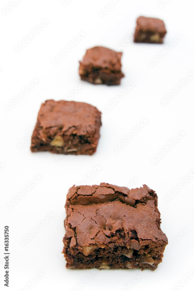 Four brownies on a white background