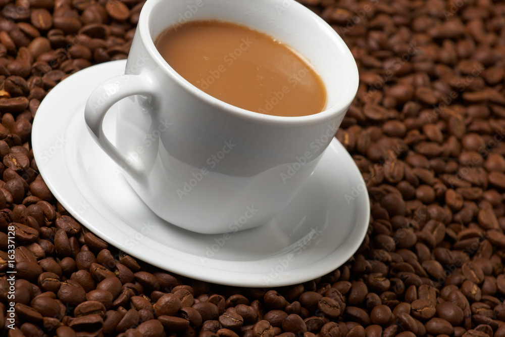 Cup with coffee, costing on coffee grain Cup with coffee, costing on coffee grain