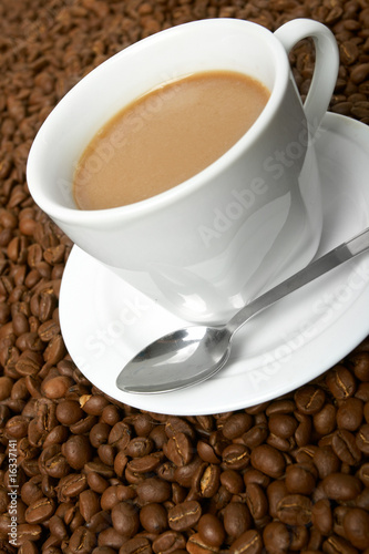 Cup with coffee, costing on coffee grain © fox17