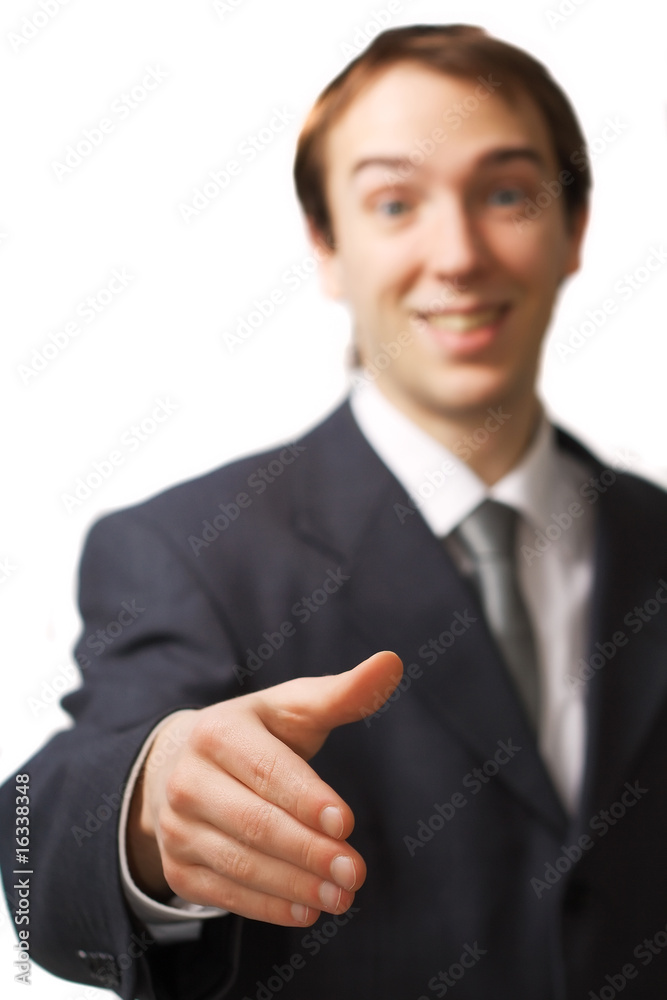 Happy young business man handshake with focus on the hand Happy young business man handshake with focus on the hand