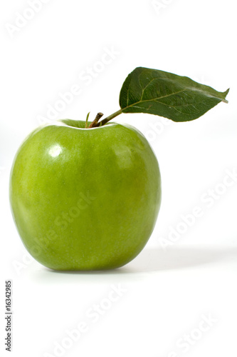 Green apple with green leaf