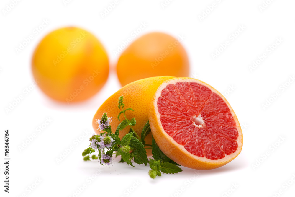 sliced grapefruit with mint on white sliced grapefruit with mint on white