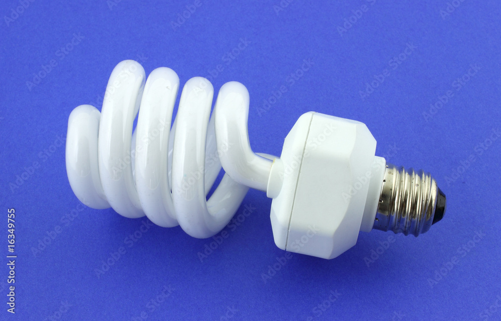 A compact fluorescent light bulb against a blue background. A compact fluorescent light bulb against a blue background.