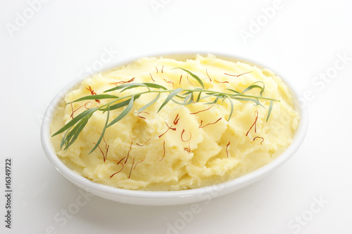 mashed potato with tarragon in a white bowl