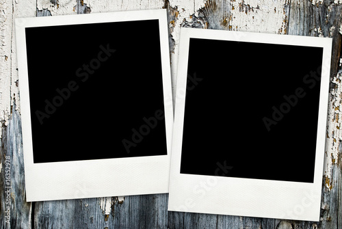 Vintage photos on old wooden background