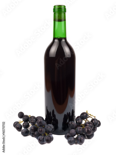 Red wine in bottle and grapes