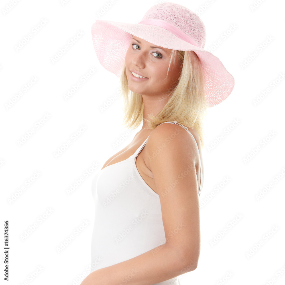 Young woman wearing a pink straw hat Young woman wearing a pink straw hat