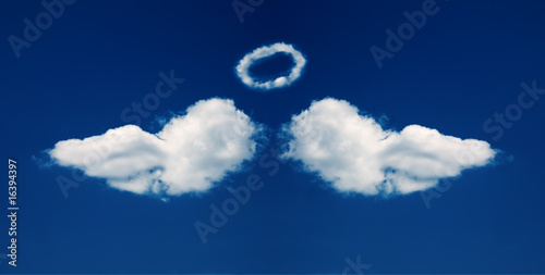 Angel wings and nimbus formed from clouds
