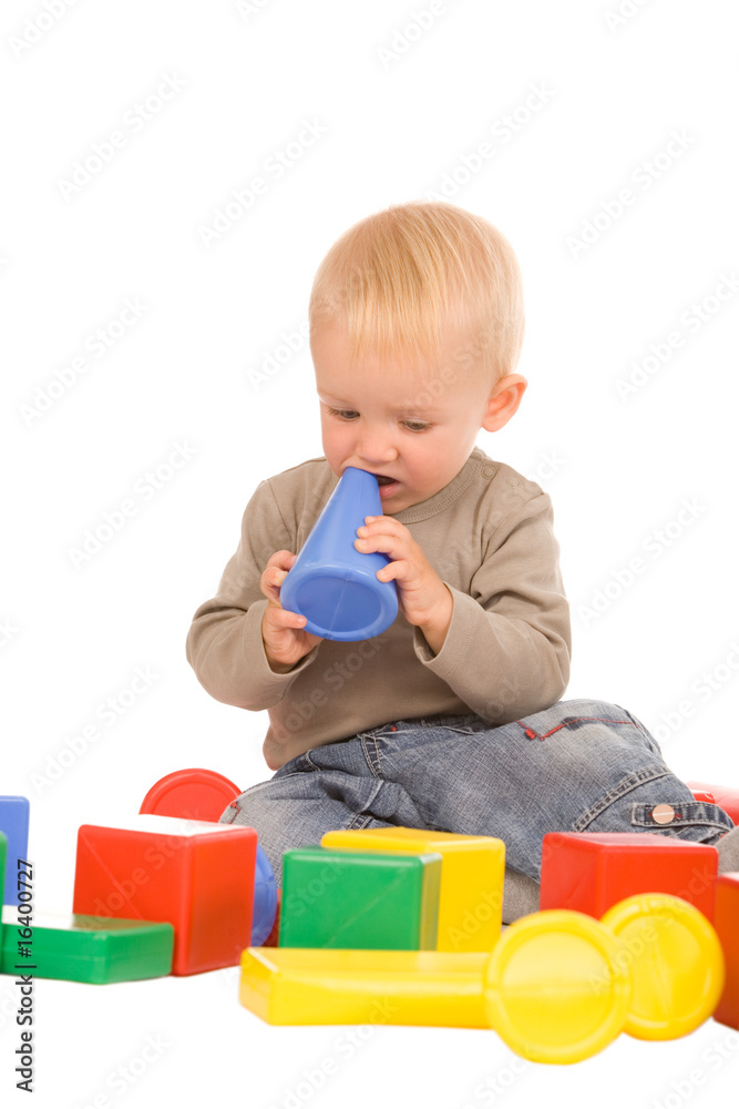 portrait of the young boy playing with the educational toys portrait of the young boy playing with the educational toys