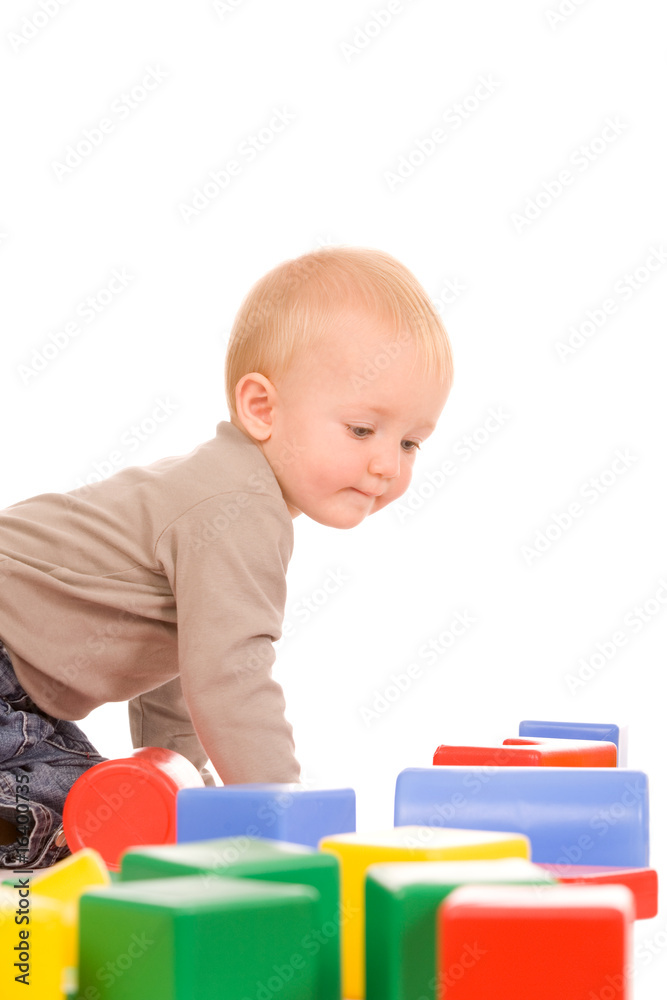 portrait of the young boy playing with the educational toys portrait of the young boy playing with the educational toys