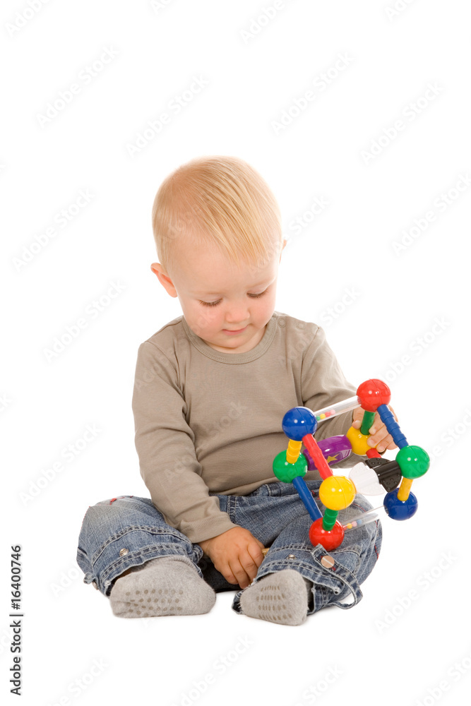 portrait of the young boy playing with the educational toys portrait of the young boy playing with the educational toys