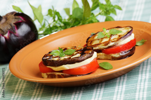 Aubergine towers with mozzarella and tomato photo