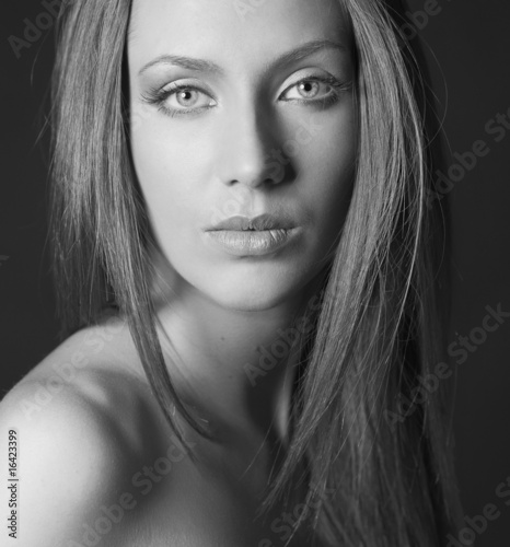 BW portrait of attractive girl over black