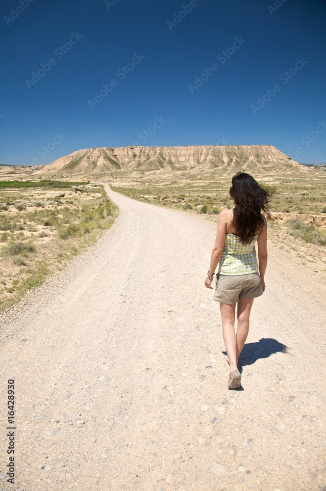 hiking woman at desert road