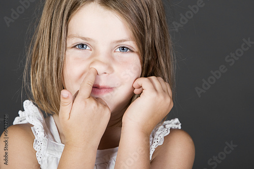 Картината върху платно Shot of a Cute Blonde Child Picking her Nose