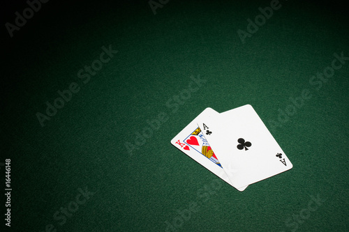 Obraz na plátně Blackjack hand on green baize table