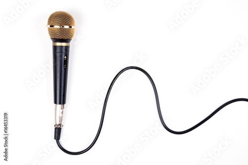 A dynamic microphone on white