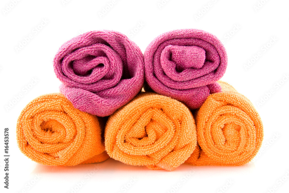 Rolls of colorful towels over white background