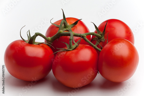 Five tomatoes on the vine