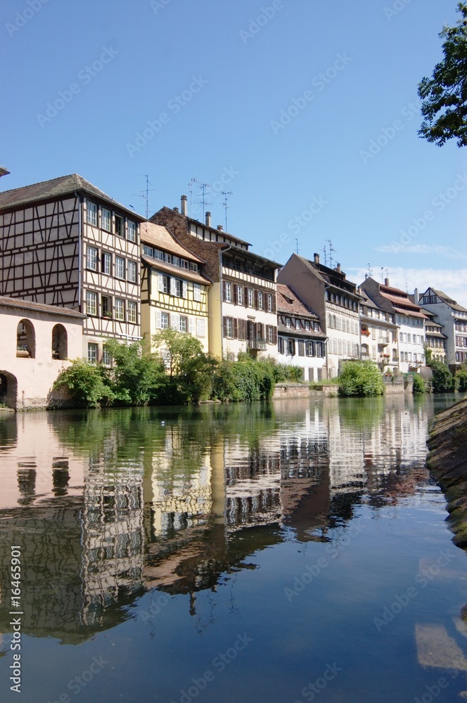 Alsace houses in Strasbourg, reflected in channel