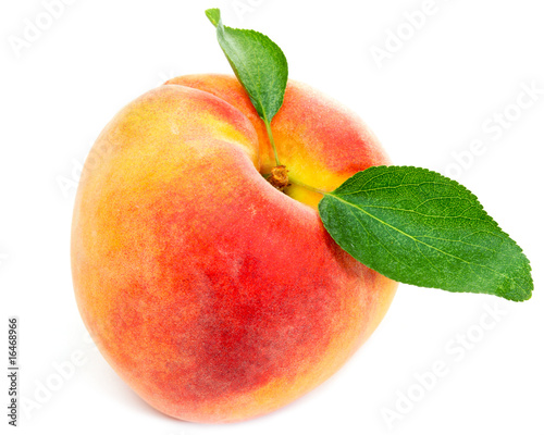 Peach with leaves isolated on white background
