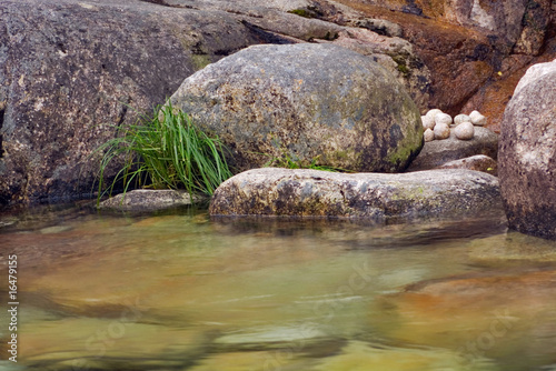 Natural, quiet, zen like composition of rocks and flowing water.